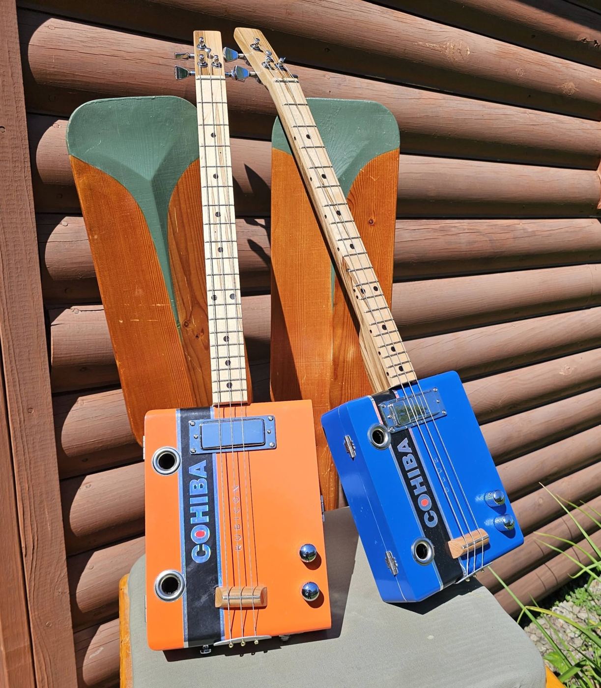 Cohiba orange and blue 3-string guitars